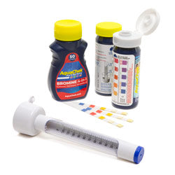 collection of spa test strips and thermometer on a white background