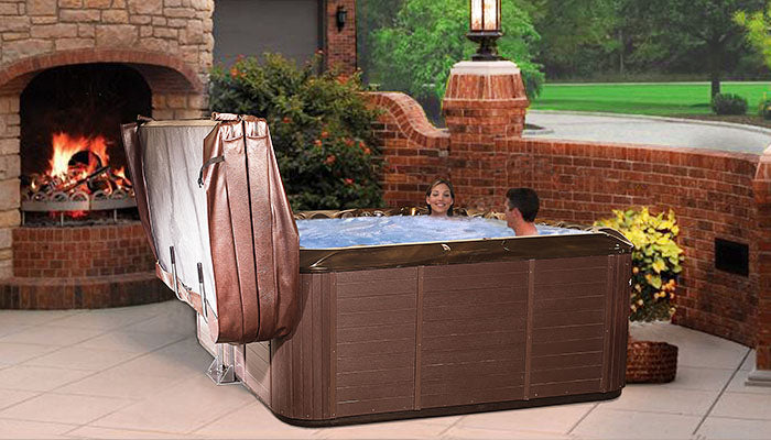 Couple in hot tub with cover lifter 