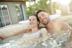 Smiling couple in hot tub