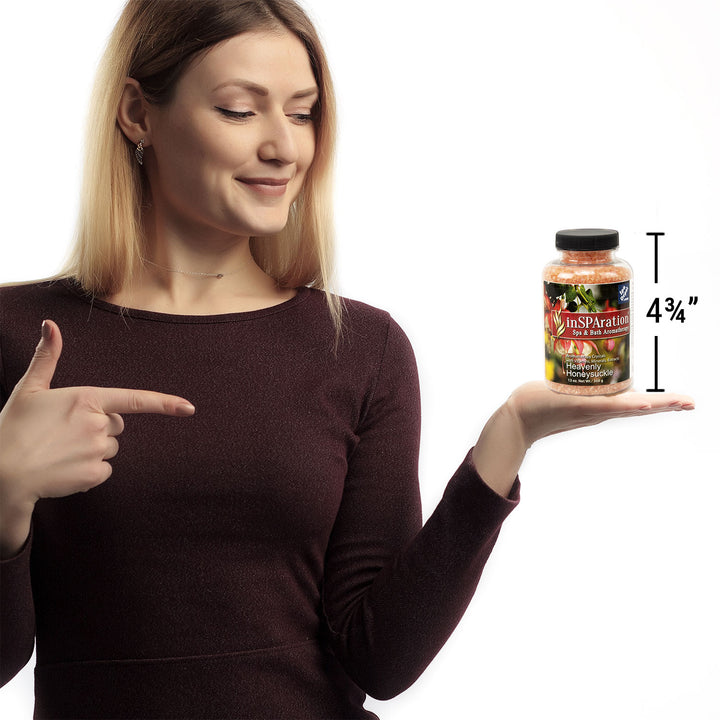  woman holding bottle of Insparation aromatherapy