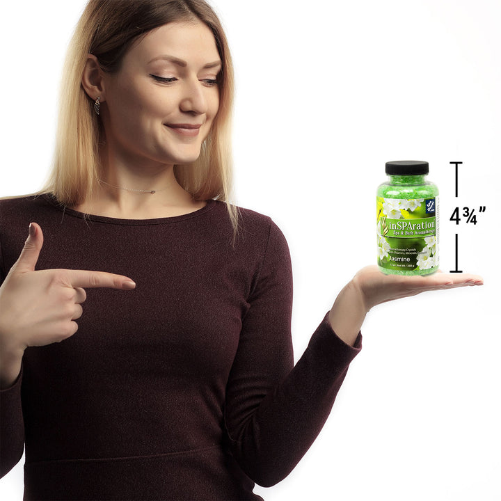  woman holding bottle of Insparation aromatherapy