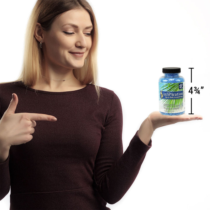  woman holding bottle of Insparation aromatherapy