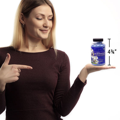 woman holding bottle of Insparation aromatherapy