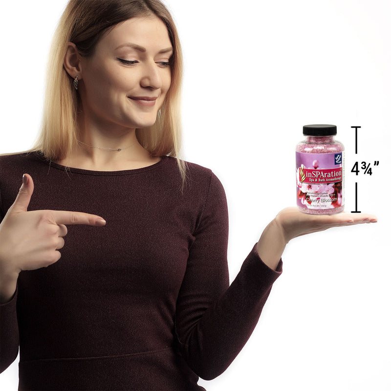 woman holding bottle of Insparation aromatherapy