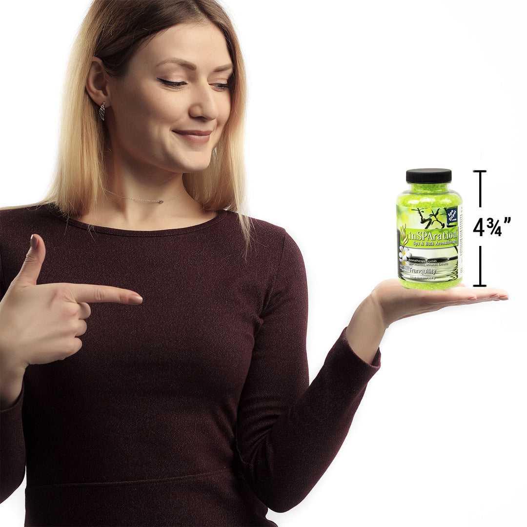 woman holding bottle of Insparation aromatherapy