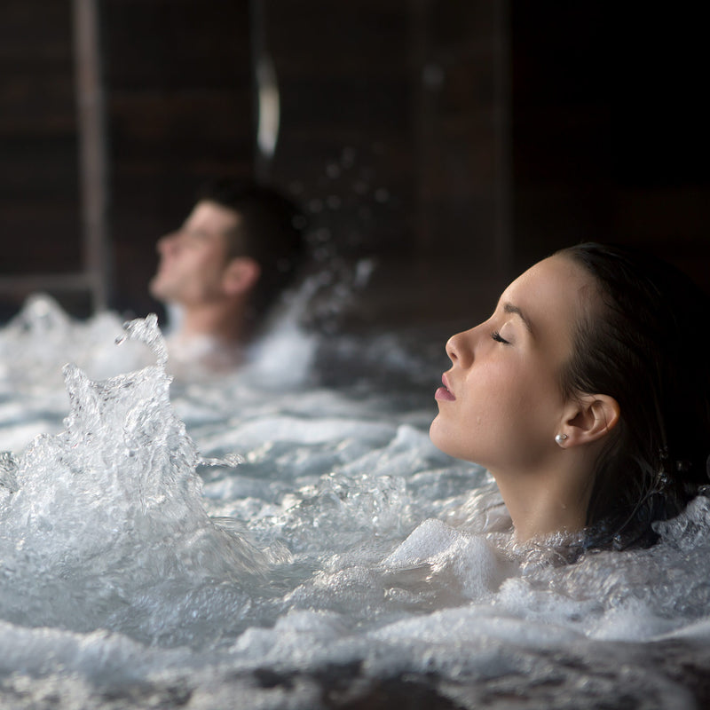 couple in bubbling hot tub